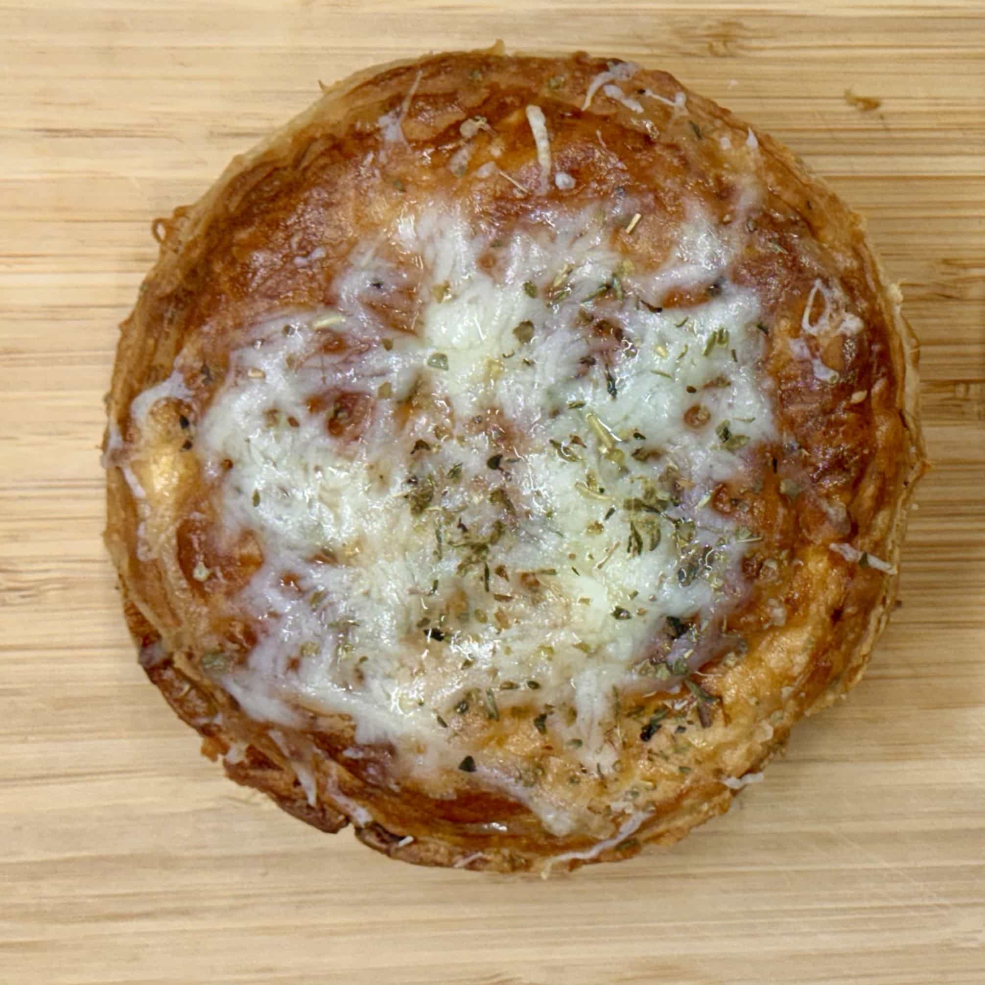 Top-down view of the French Dip pie with bubbling melted Swiss cheese